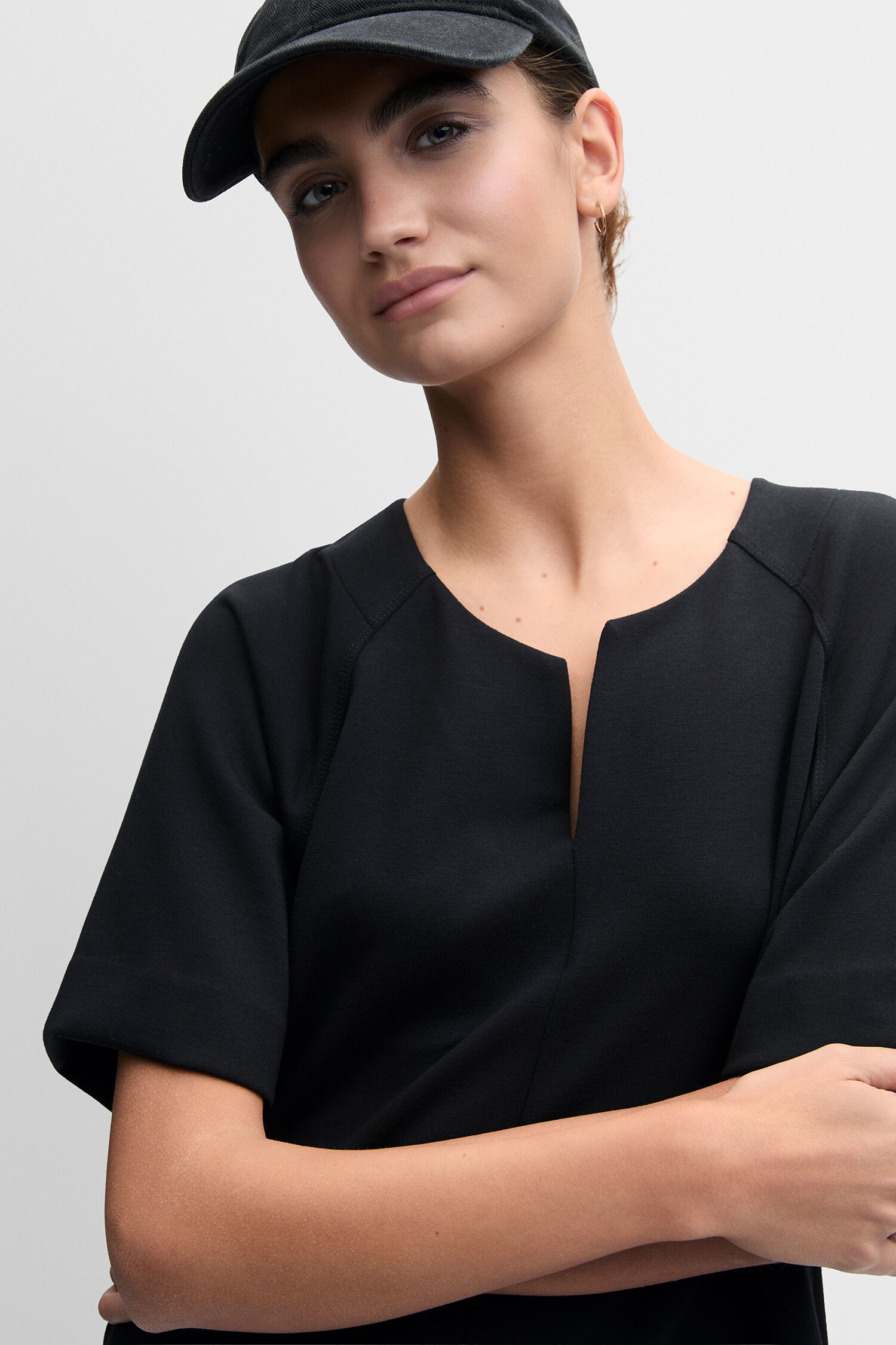 black top, short sleeve, v-neck, cap, simple